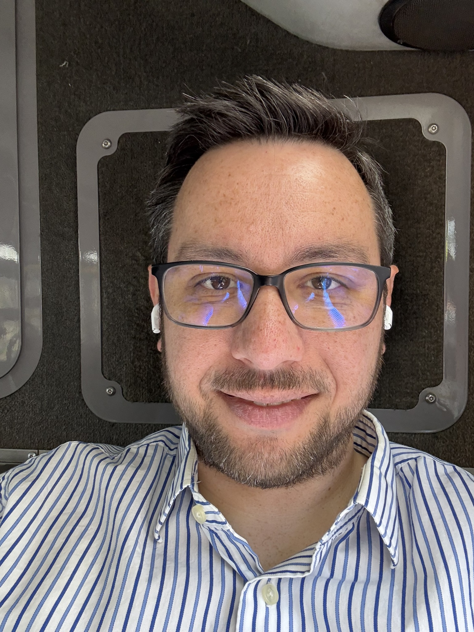 Me on a bus heading to dinner. I'm gonna get rid of the blue lens thing.