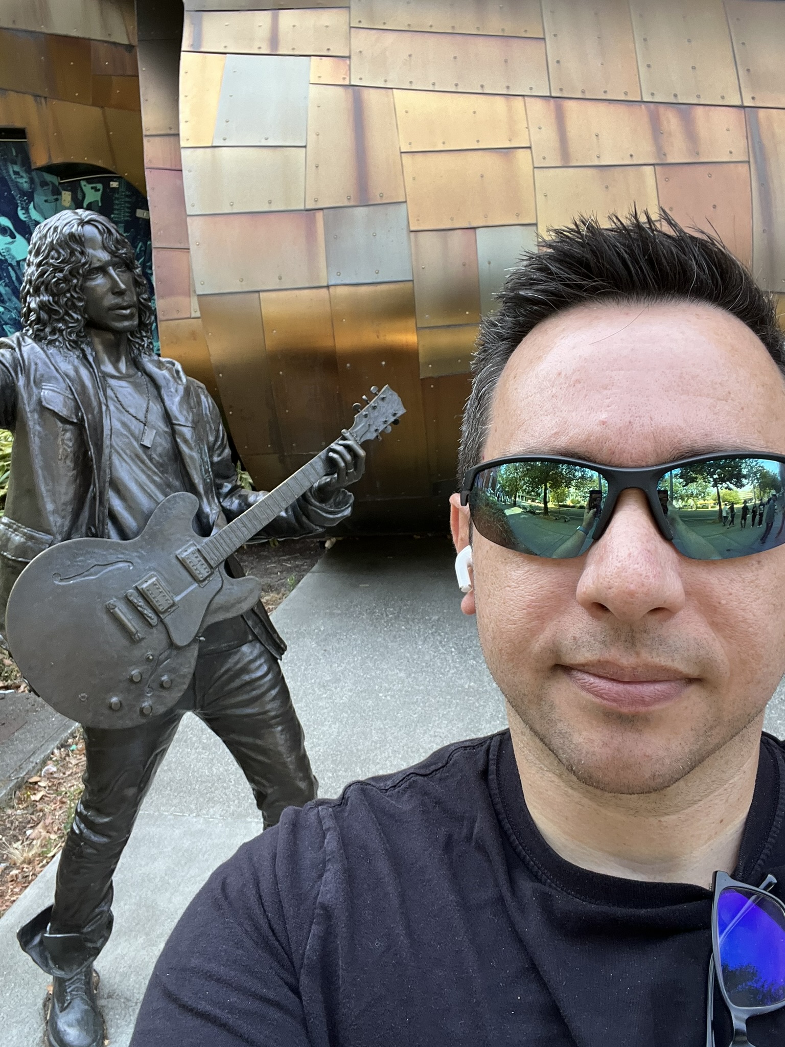 a photo of me and a statue of chris cornell