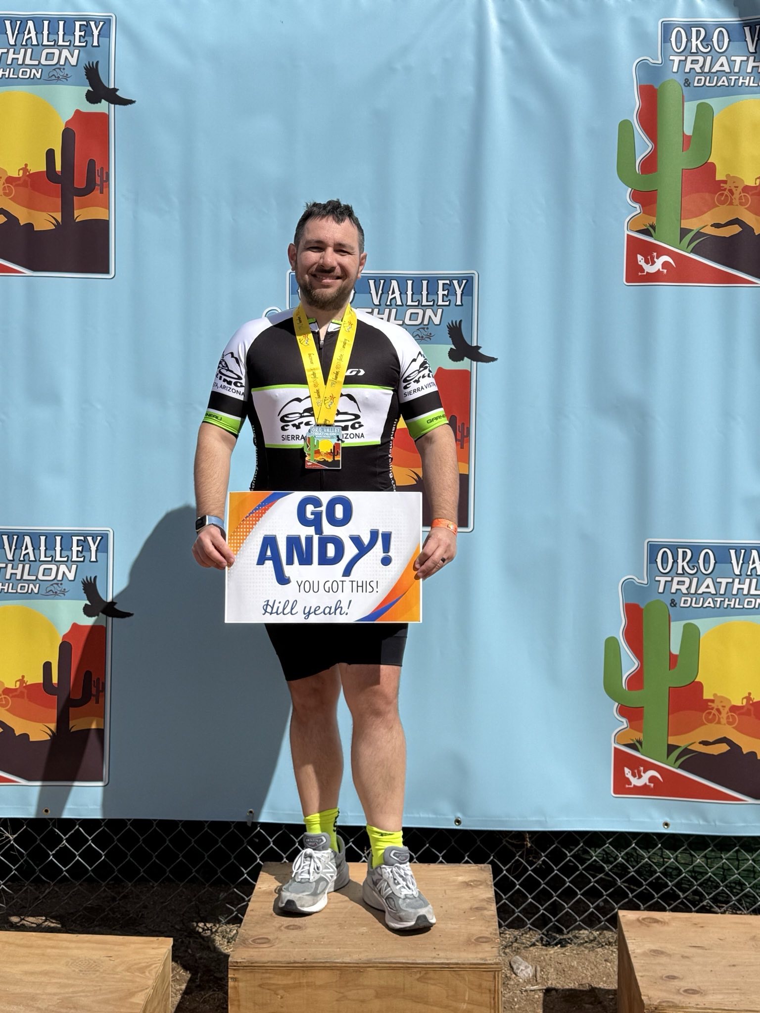 Me after completing the Oro Valley Triathlon. Sign courtesy of L!